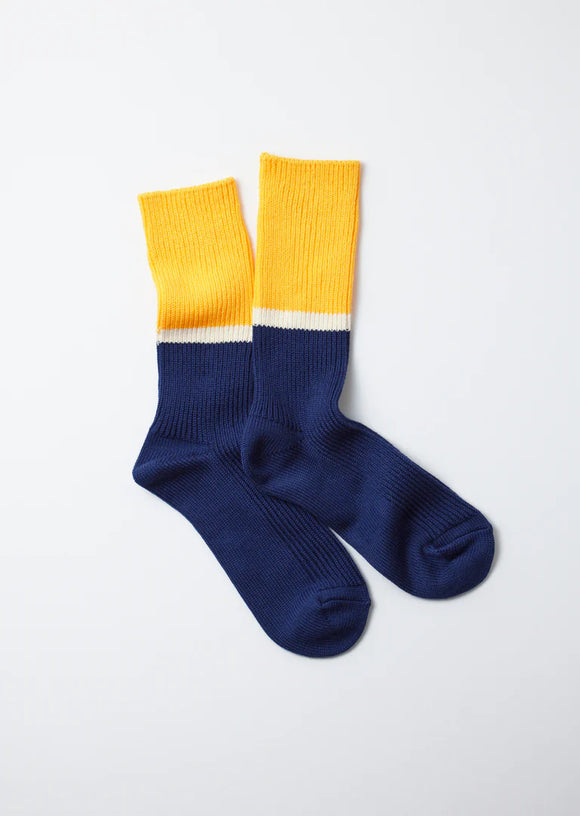 Block yellow and navy socks with white contrast line inbetween.
