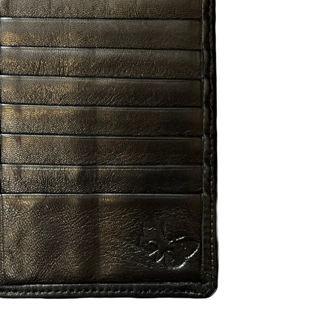 Close-up of a dark brown leather wallet showing card slots, stitching, and an embossed logo on a white background.