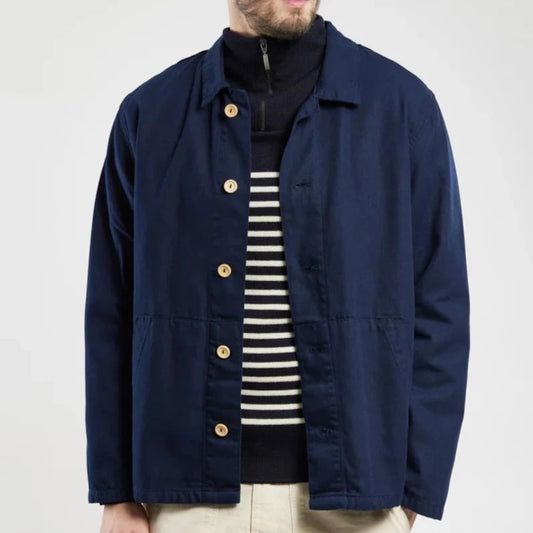 A classic fisherman's style chore jacket in a deep marine blue with contrasting wooden buttons.