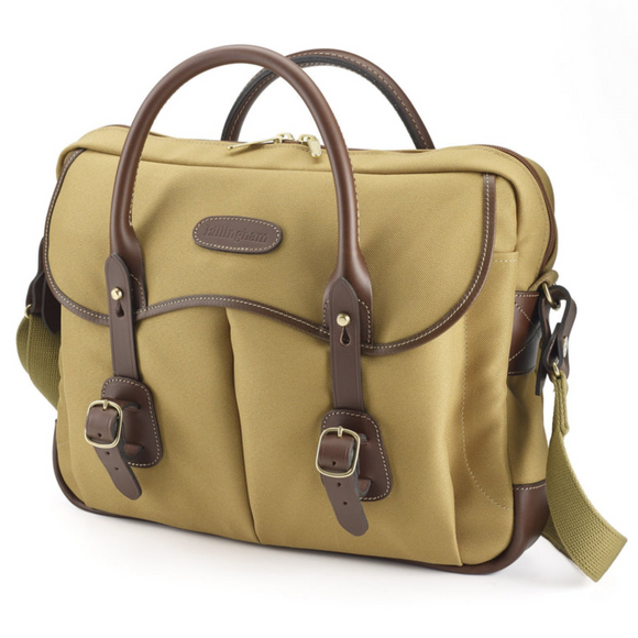 Khaki and fibre canvas cloth with contrasting chocolate leather. two large front buckled pockets and leather logo on front.