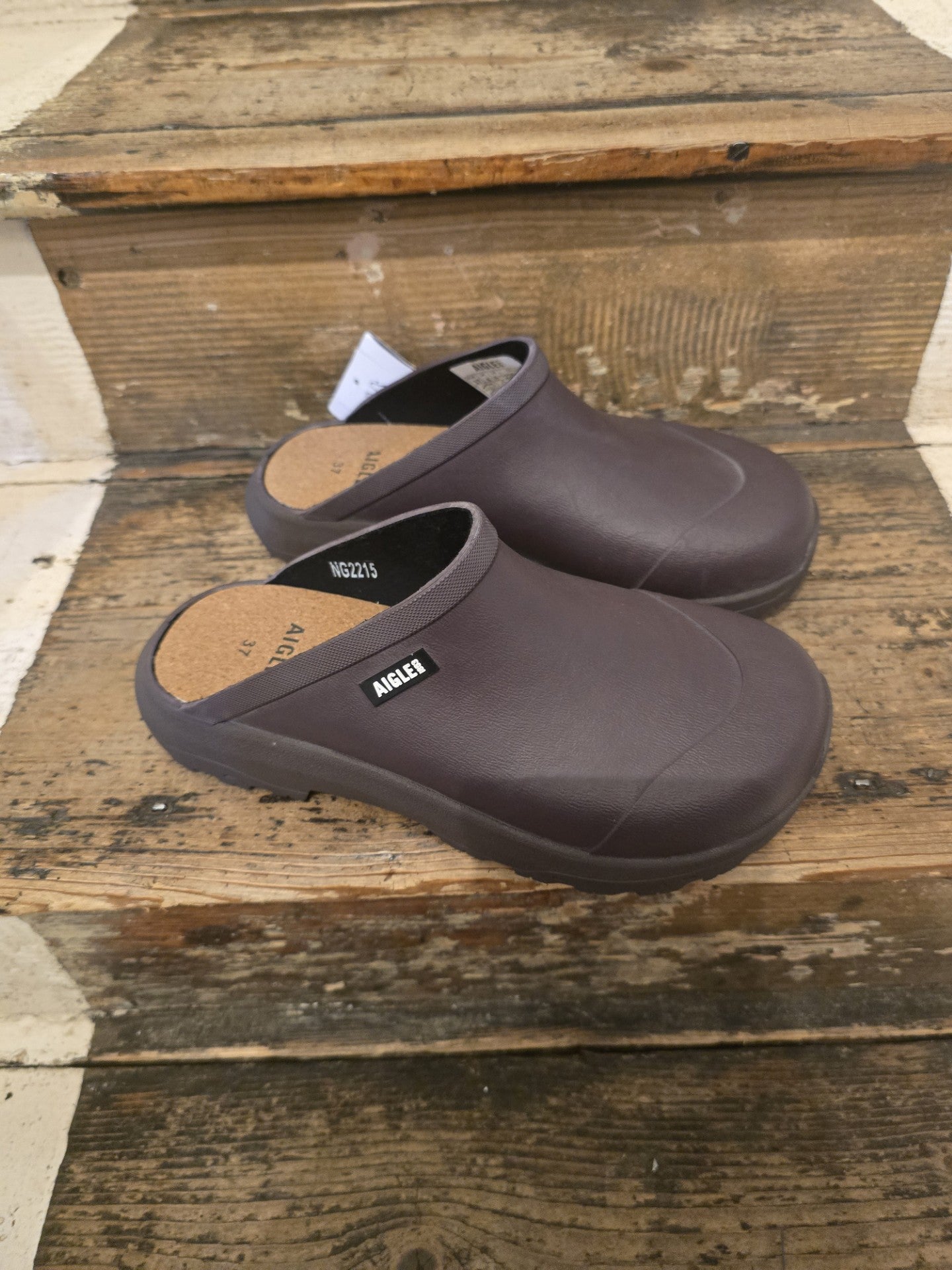 Brown clogs on a wooden surface