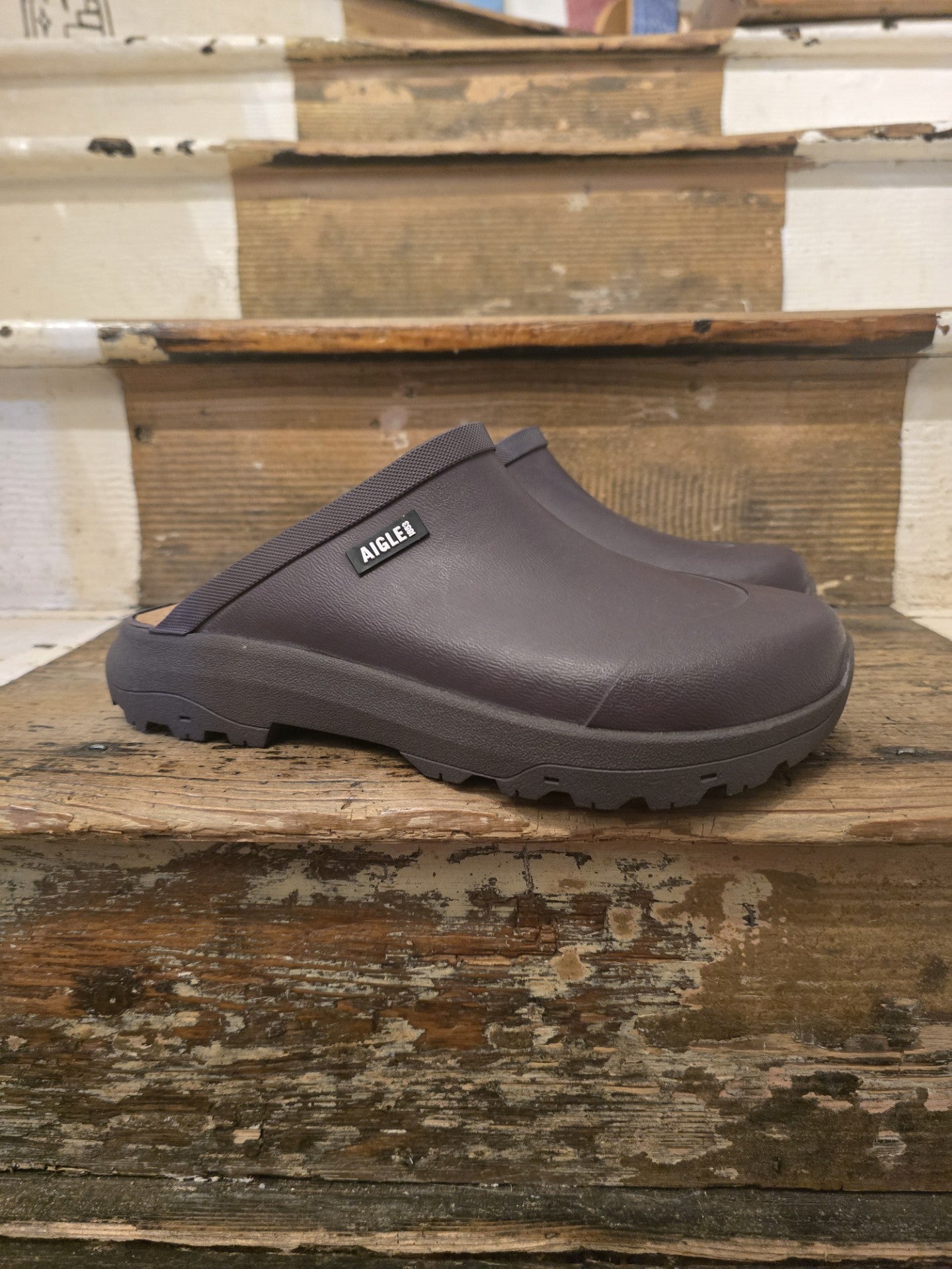 Brown clog shoe on a wooden surface