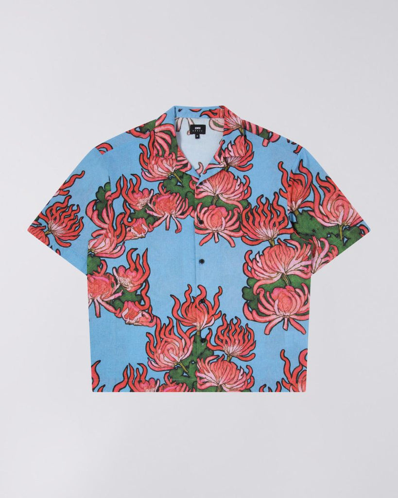 Blue patterend shirt with red,pink and green floral pattern. Cuban collar and short sleeve design.