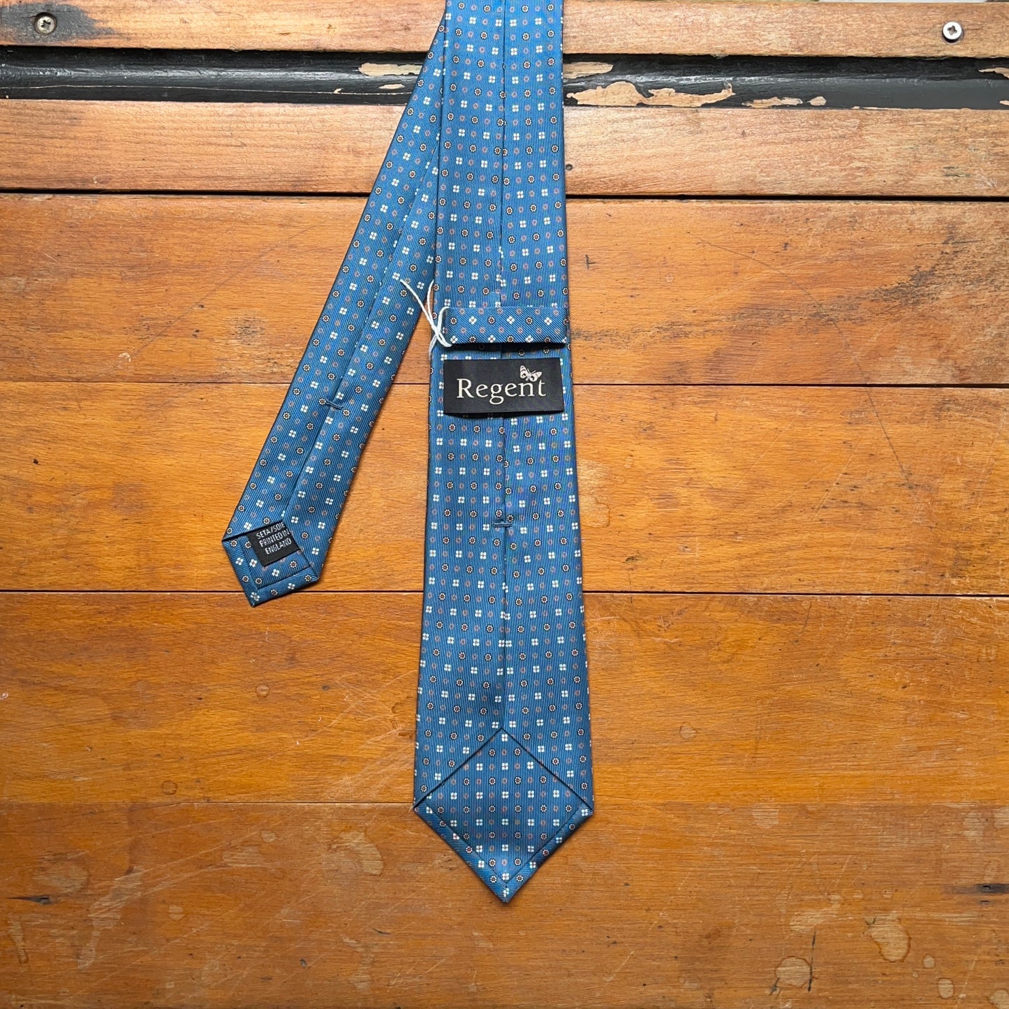 Regent - Woven Silk Tie - Petrol Blue Daisy Motif - reverse