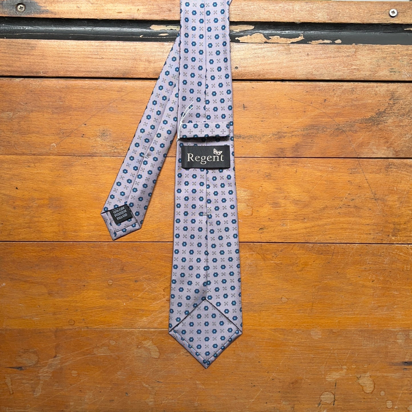 Regent - Woven Silk Tie - Silver Lilac with Blue Flower Motif - reverse