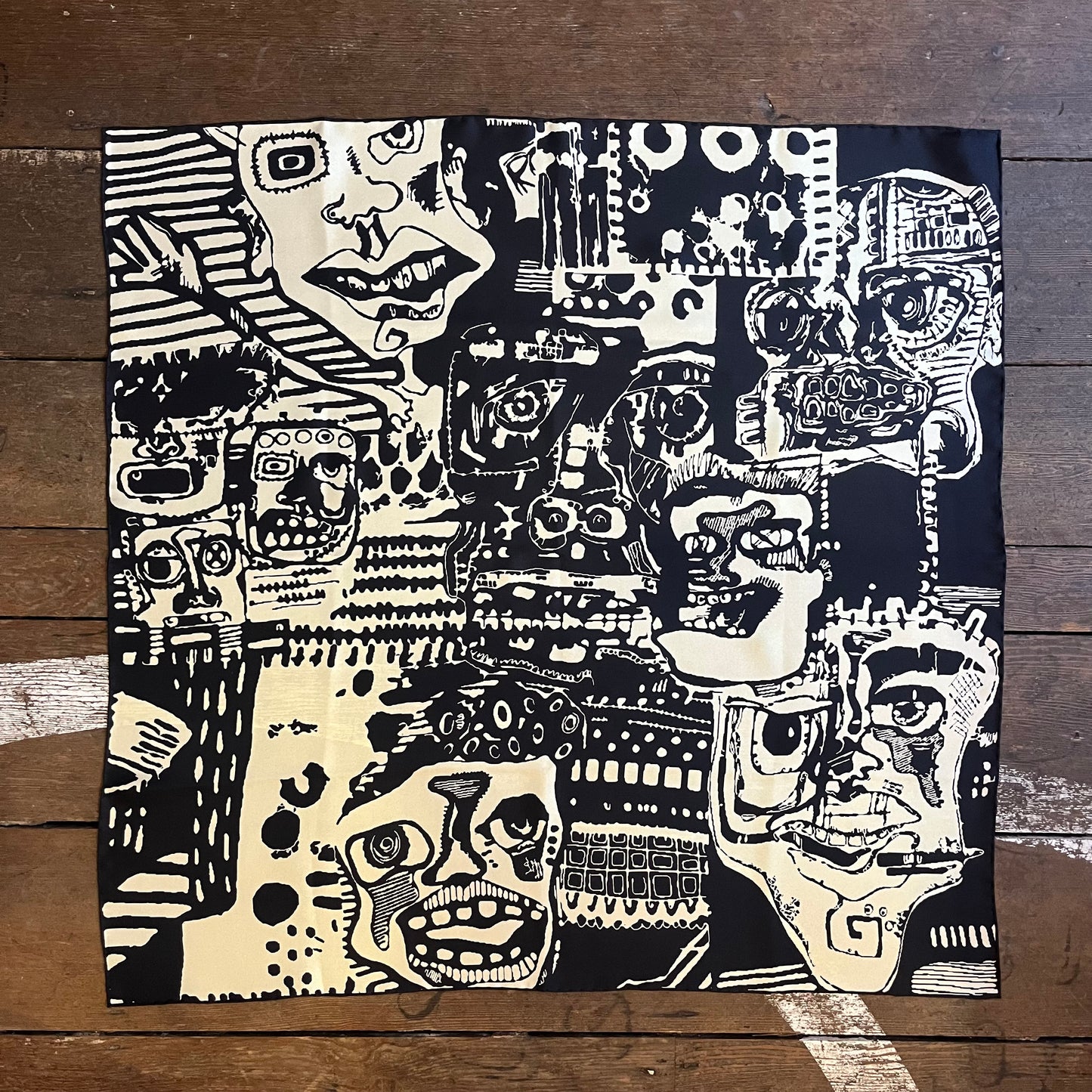 Silk scarf, handmade in England and designed by Lula Regent. The design incorporates black and white images of faces