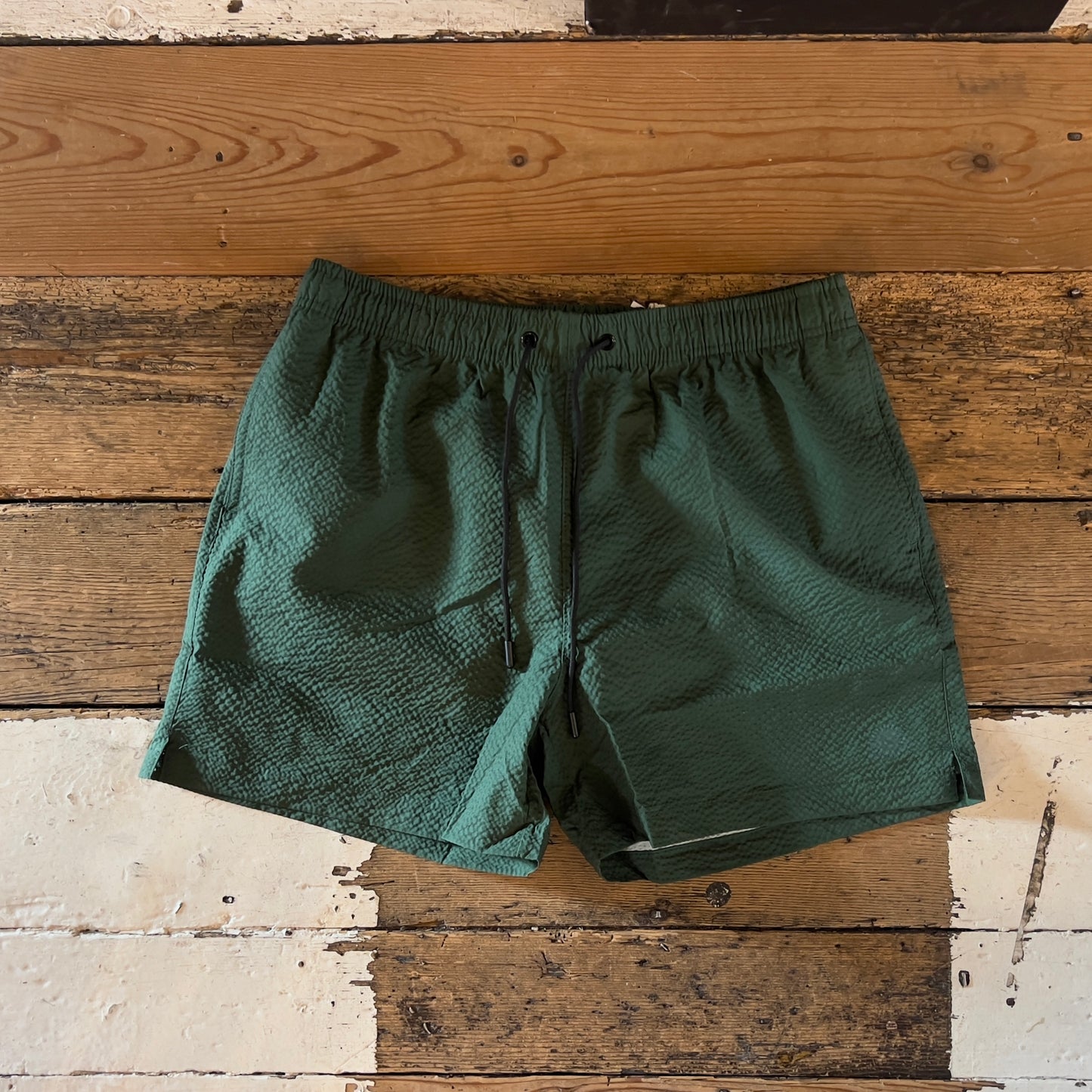Green swim shorts