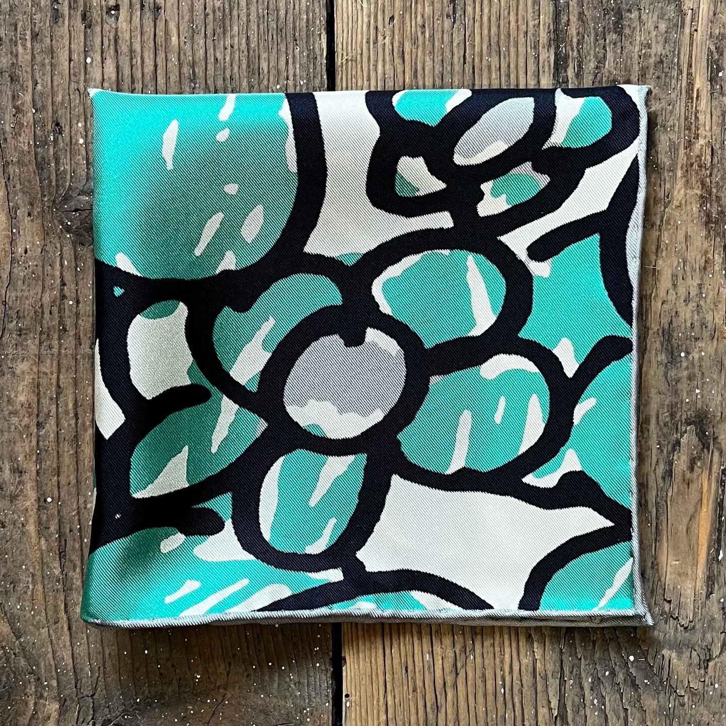 Silk pocket square with hand drawn green daisy design