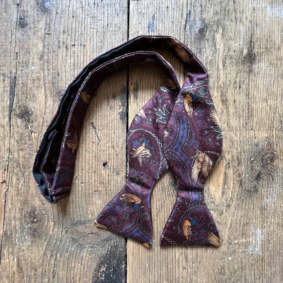 Burgundy silk bow tie with paisley and duck pattern