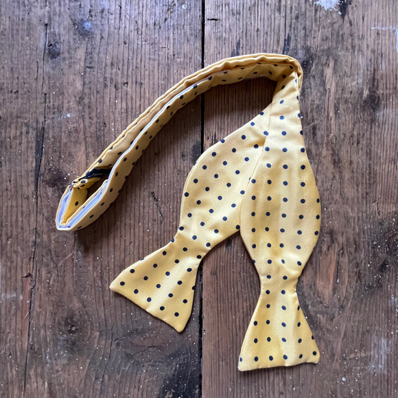 Yellow silk bow tie with navy spot