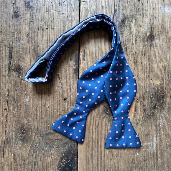 Petrol blue silk bow tie with pink spots