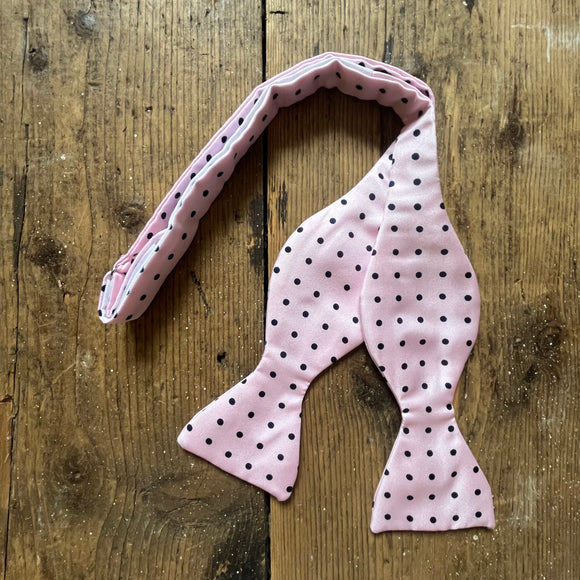 Pink silk bow tie with navy spots