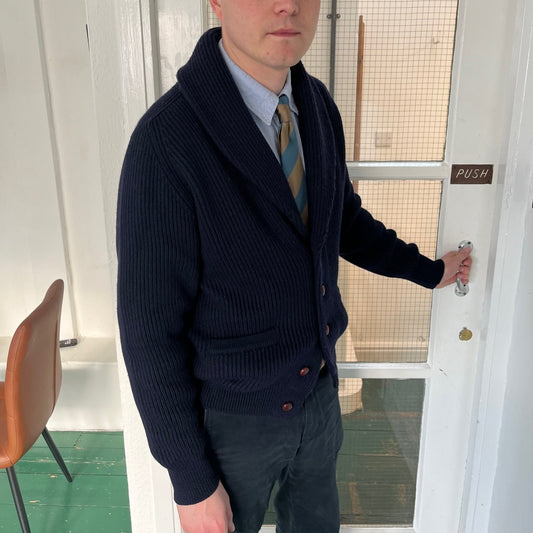 Shawl neck extra fine merino wool cardigan.