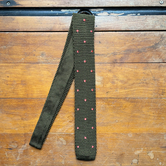 Knitted silk tie in khaki green with orange spots
