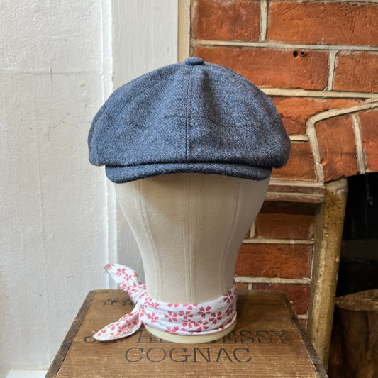 Pale blue baker boy cap with dark overcheck