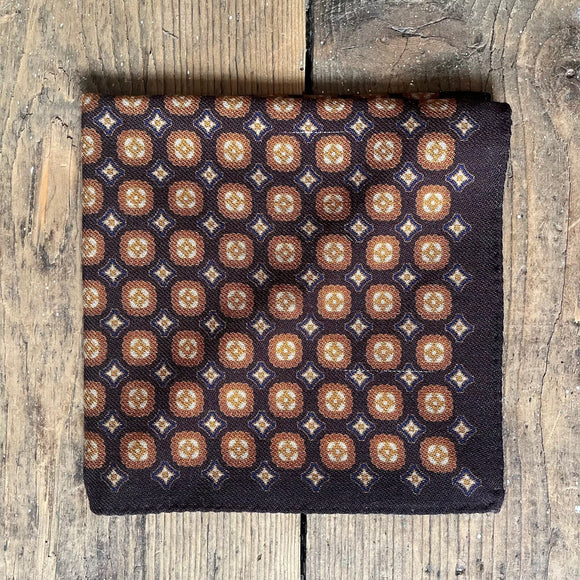 Brown wool handkerchief with orange and blue motif pattern