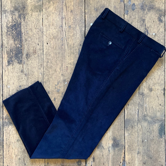 Navy pin corduroy trousers cut on a slim block and designed exclusively by British Heritage brand Regent with unfinished bottoms.