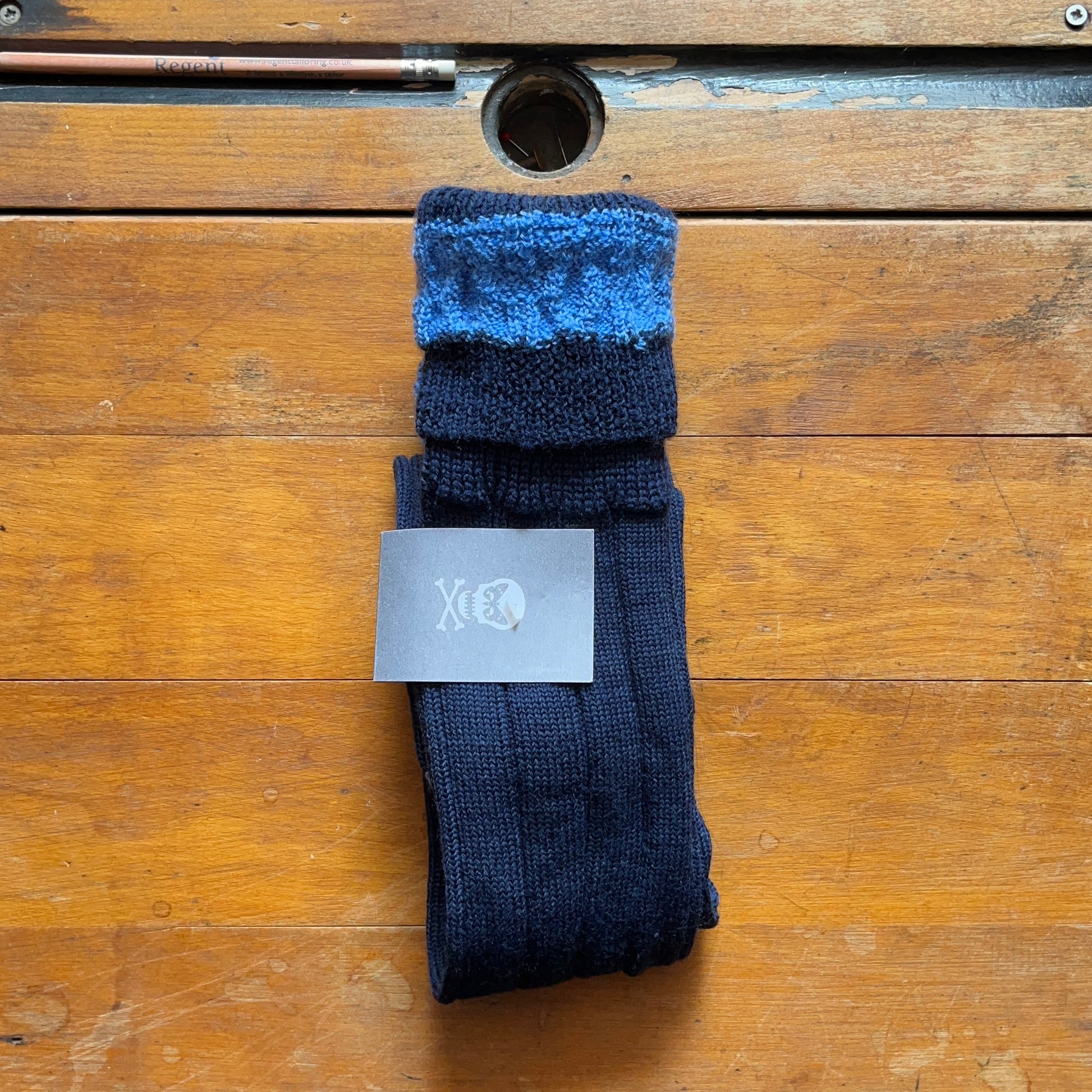 Navy blue woollen boot sock with contrasting baby blue cuff
