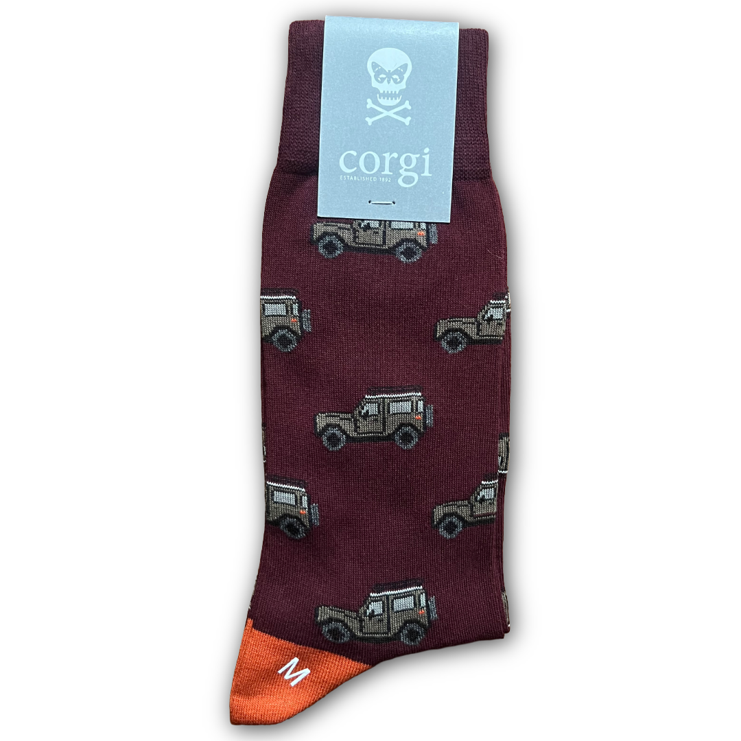 Maroon sock with Land Rover pattern and 'corgi' brand label on a white background. Sold in Salisbury by regent tailoring