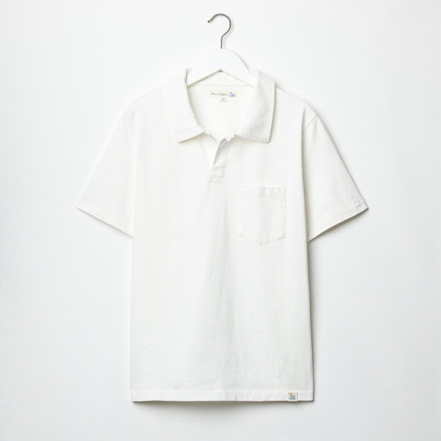 White polo, one button.