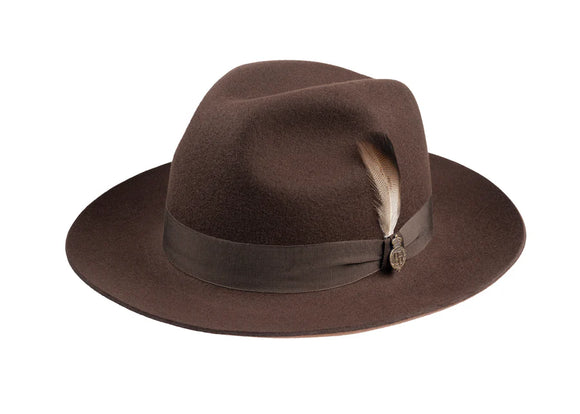 Brown wool fedora hat with matching brown ribbon and finished with Christy's badge and feather 