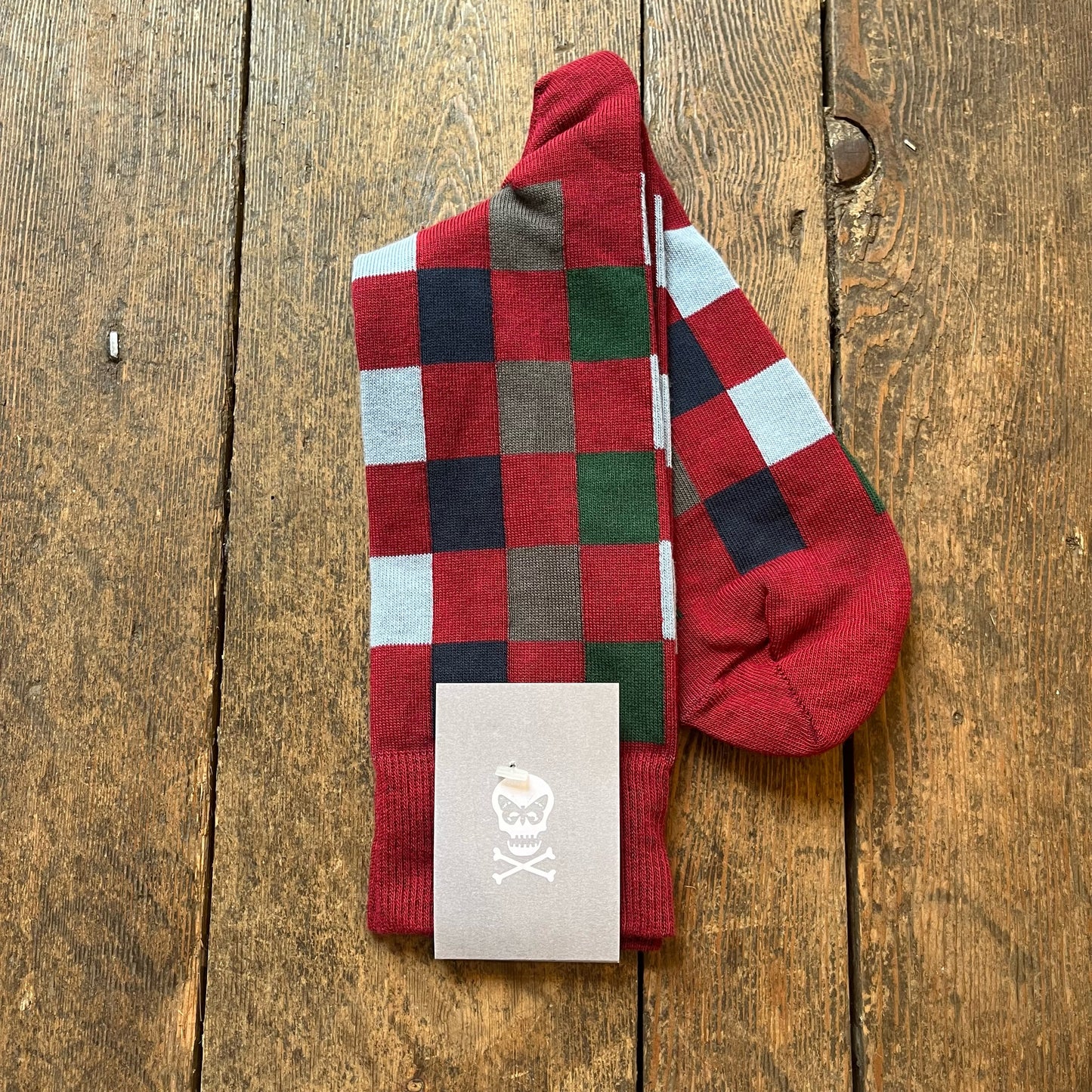 Burgundy socks with navy, light blue, green and gray checks
