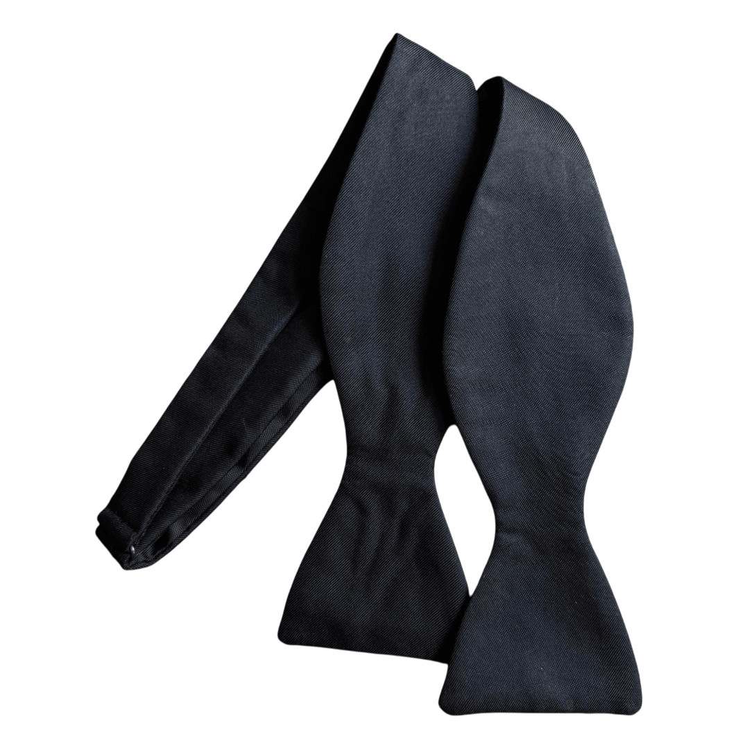 Regent Tailoring black untied bow tie made from 100% woven silk for formal events