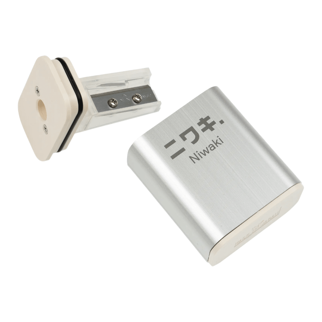 Regent Tailoring Niwaki NJK aluminium pencil sharpener with rice resin base and spare blade, made in Japan.