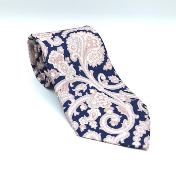 A luxury silk tie designed by and handmade exclusively for Regent. Deep navy is overlaid by royal giant pink paisley pattern.