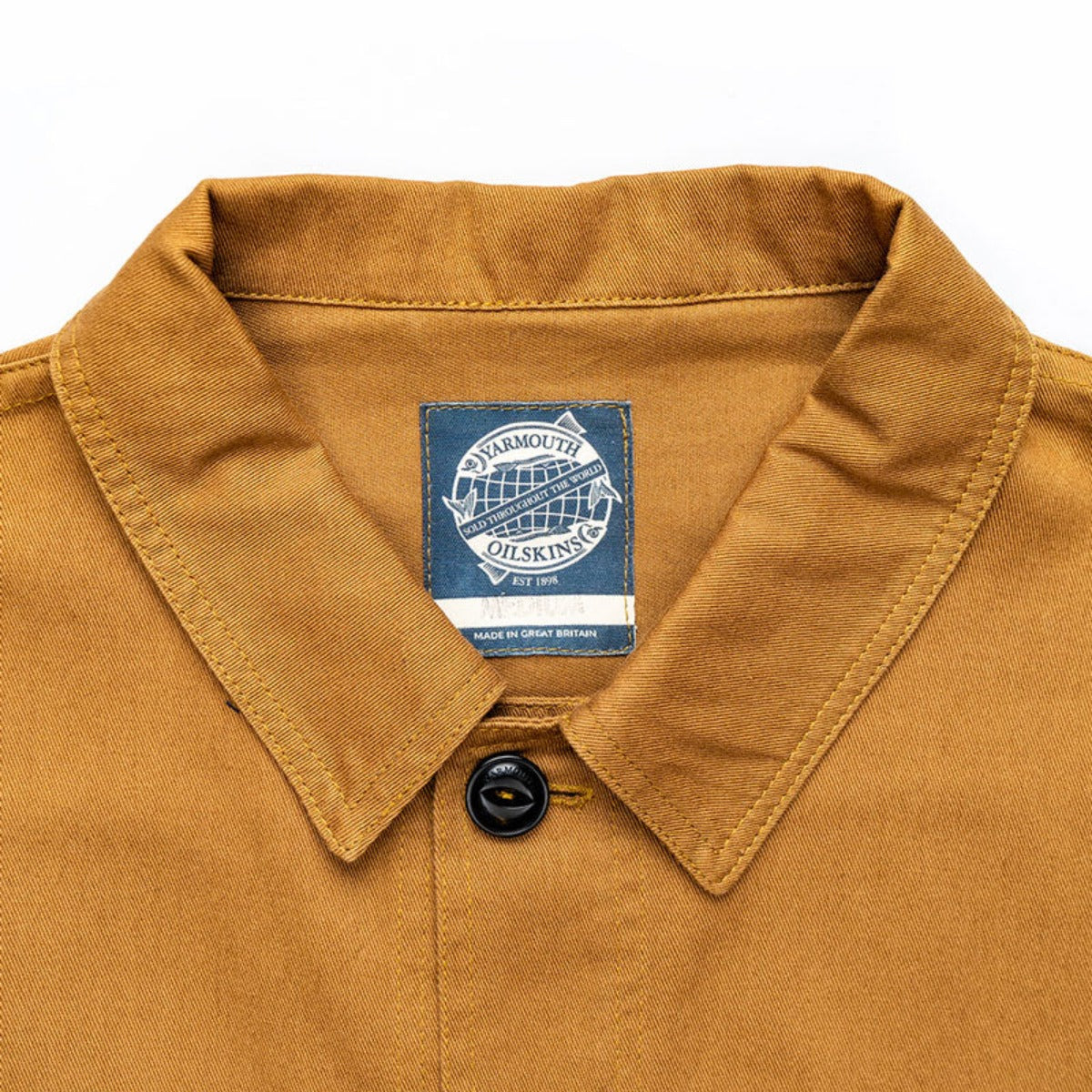 The Drivers Jacket from Yarmouth Oilskin is a short style jacket. A classic garment from times past. Originally popular in the 30's worn by Bus drivers in a very similar style and design. This particular jacket includes a shirt style collar