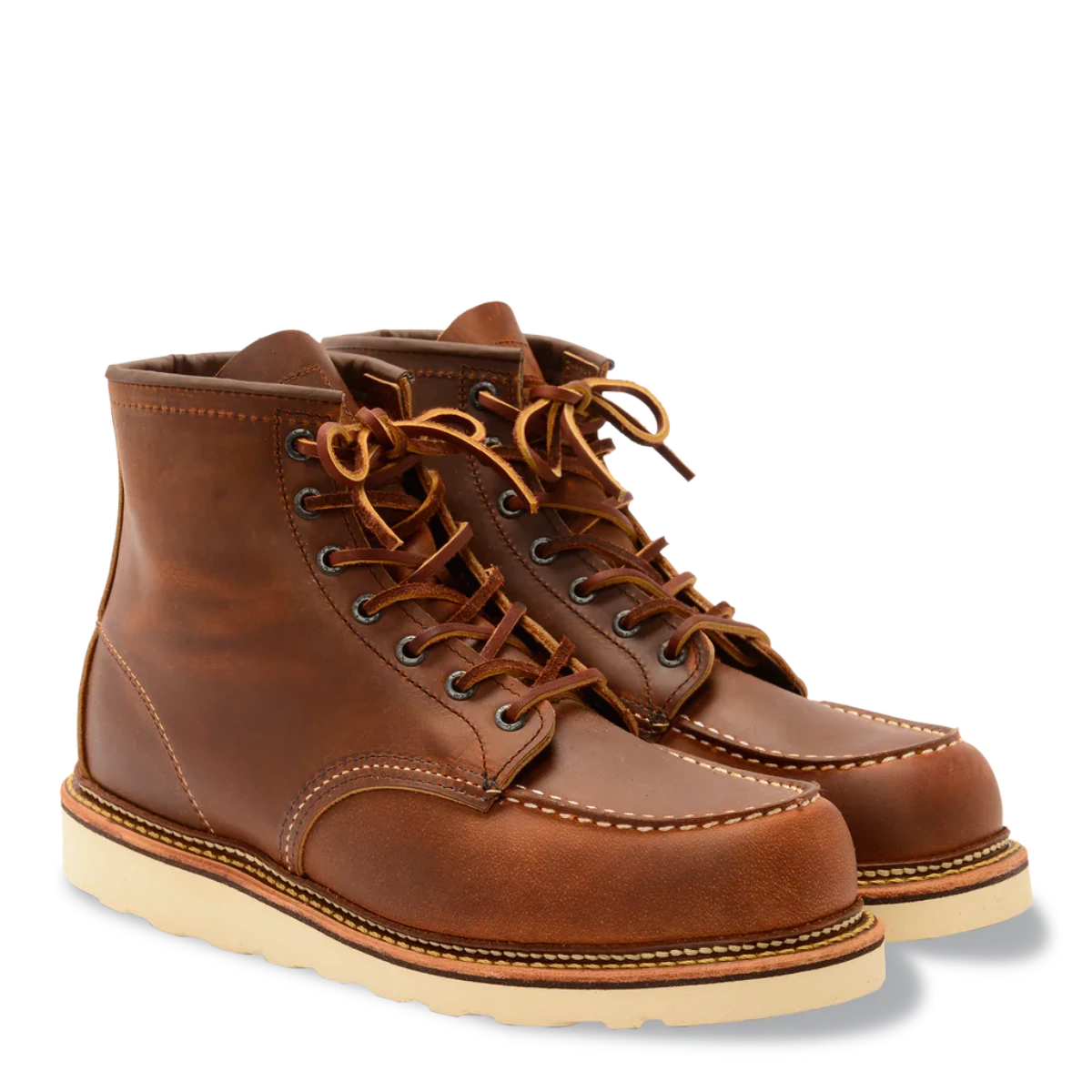 Brown leather Red Wing boots with cream soles, double stitching and leather laces. Seven eyelets.