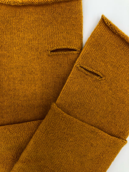 Luxury superfine Mongolian cashmere wristwarmers designed and made exclusively by Regent, featuring thumb hole and curl hem. 
