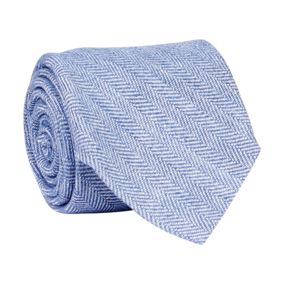 A luxury wool and silk tie designed by and handmade exclusively for Regent. Dazzling sky blue is picked out finely by fishbone diagonals, for a commanding, serene finish. Excellent for everyday and special occasions alike.