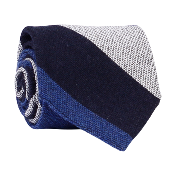 A luxury wool and silk tie designed by and handmade exclusively for Regent. Smart, serene navy and blue ride across sail-white for a calm, commanding finish. Excellent for everyday and special occasions alike. 