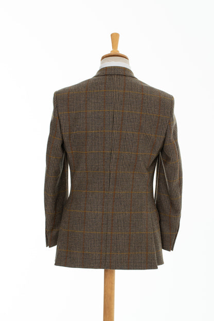 A two-button tweed jacket with overcheck from Heritage UK indie designer Regent, featuring a three-button cuff, double vent, burgundy silk-like lining and slant flap pockets. 