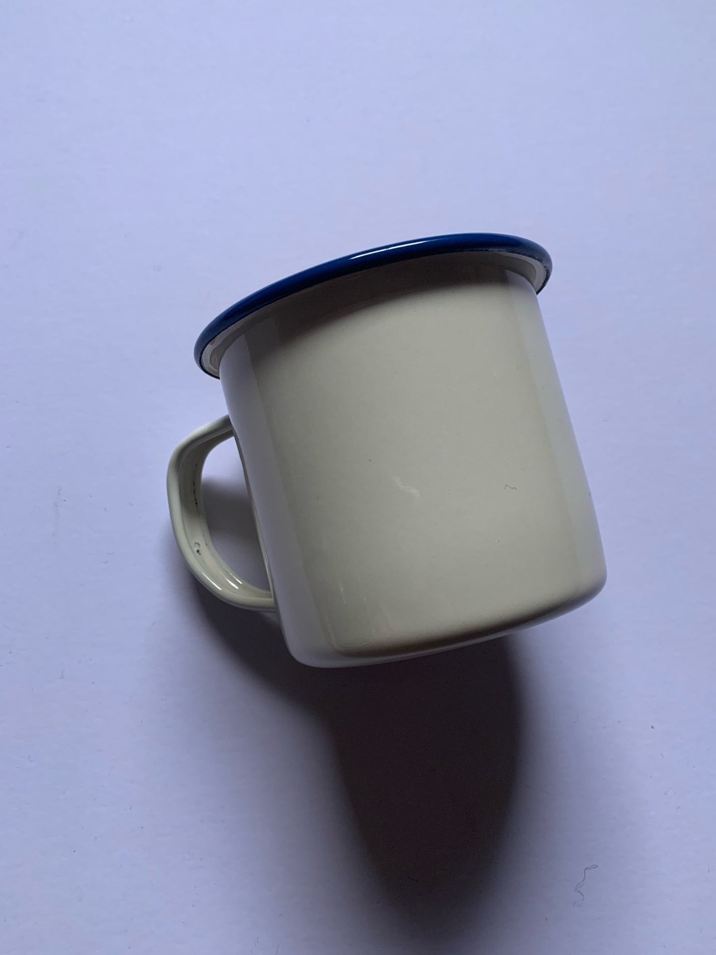 White enamelware mug which is durable, practical and travels well. Iconic, aesthetic and practical, it's the perfect cup for your morning brew, whether at home or out on the trail, and the look fits well into any homestead, making a great gift for those newly renting or home-owning. 