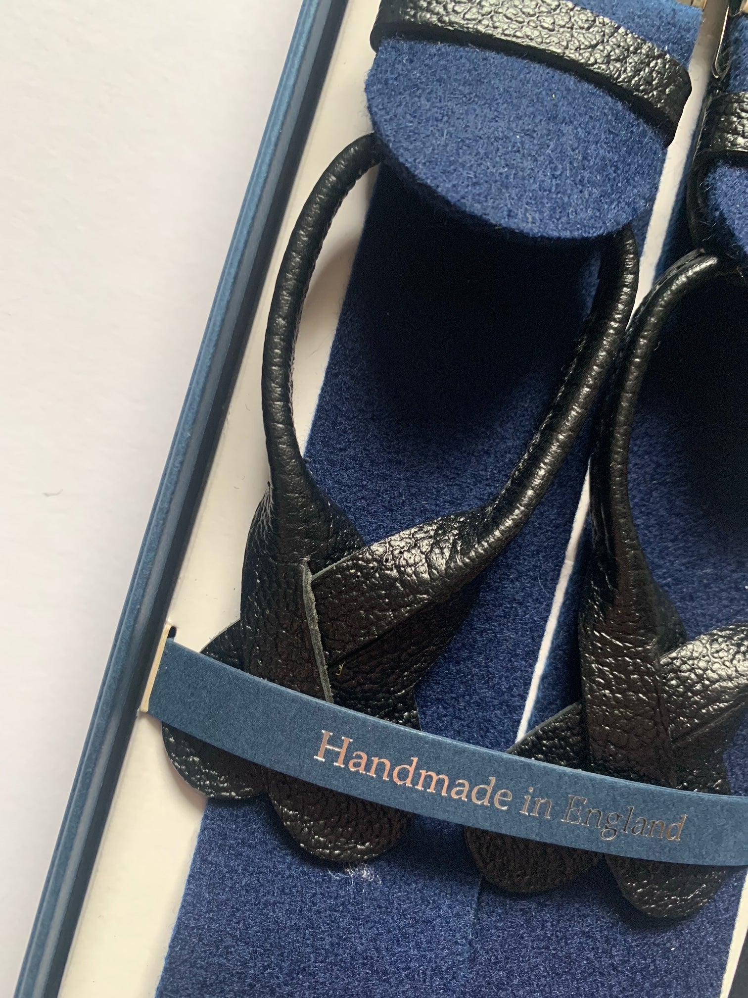 Navy box cloth braces with nickel fittings and black leather ends, designed and made in the UK exclusively for Regent. The braces are supplied with brace buttons for your trousers.