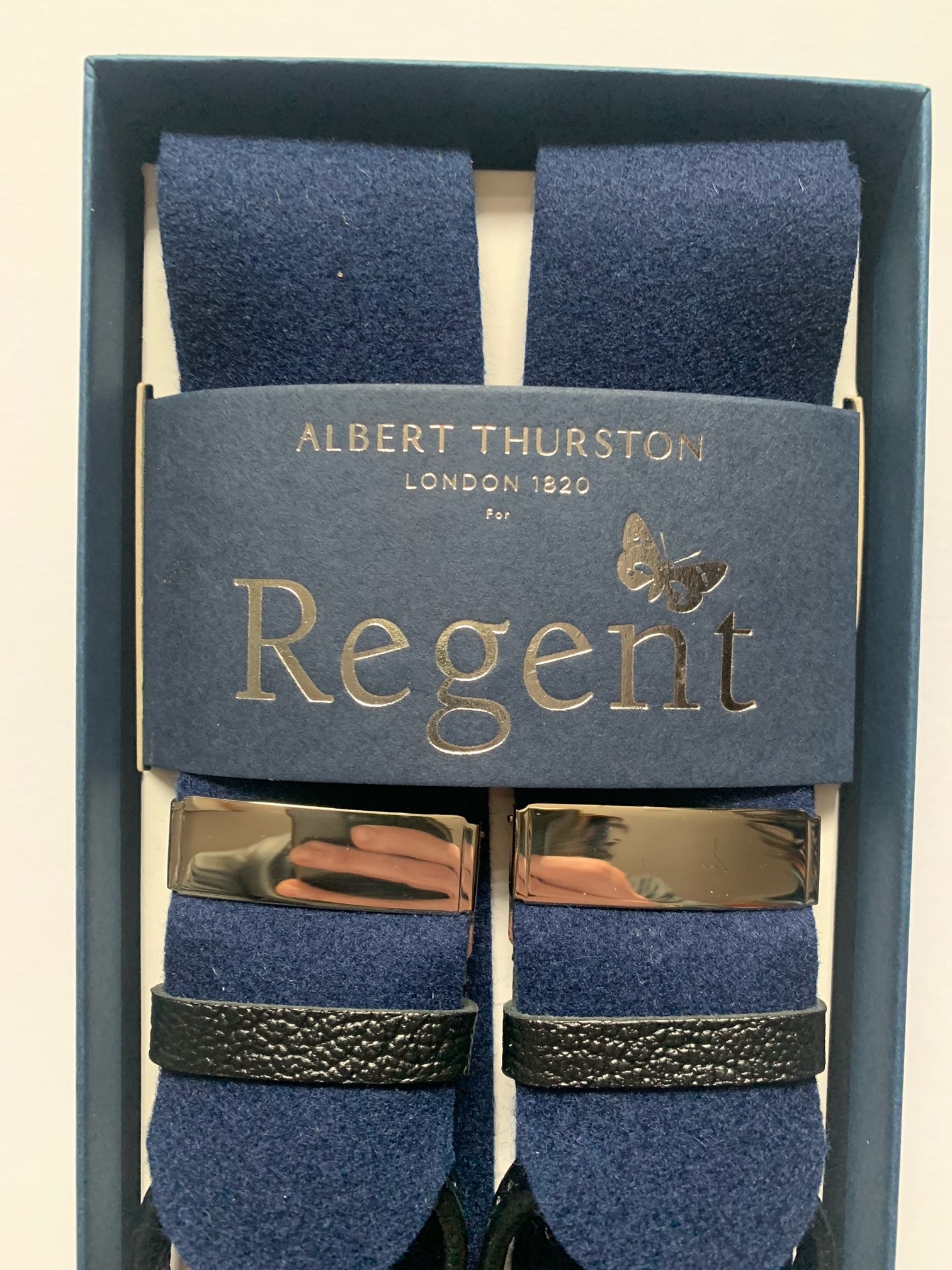 Navy box cloth braces with nickel fittings and black leather ends, designed and made in the UK exclusively for Regent. The braces are supplied with brace buttons for your trousers.