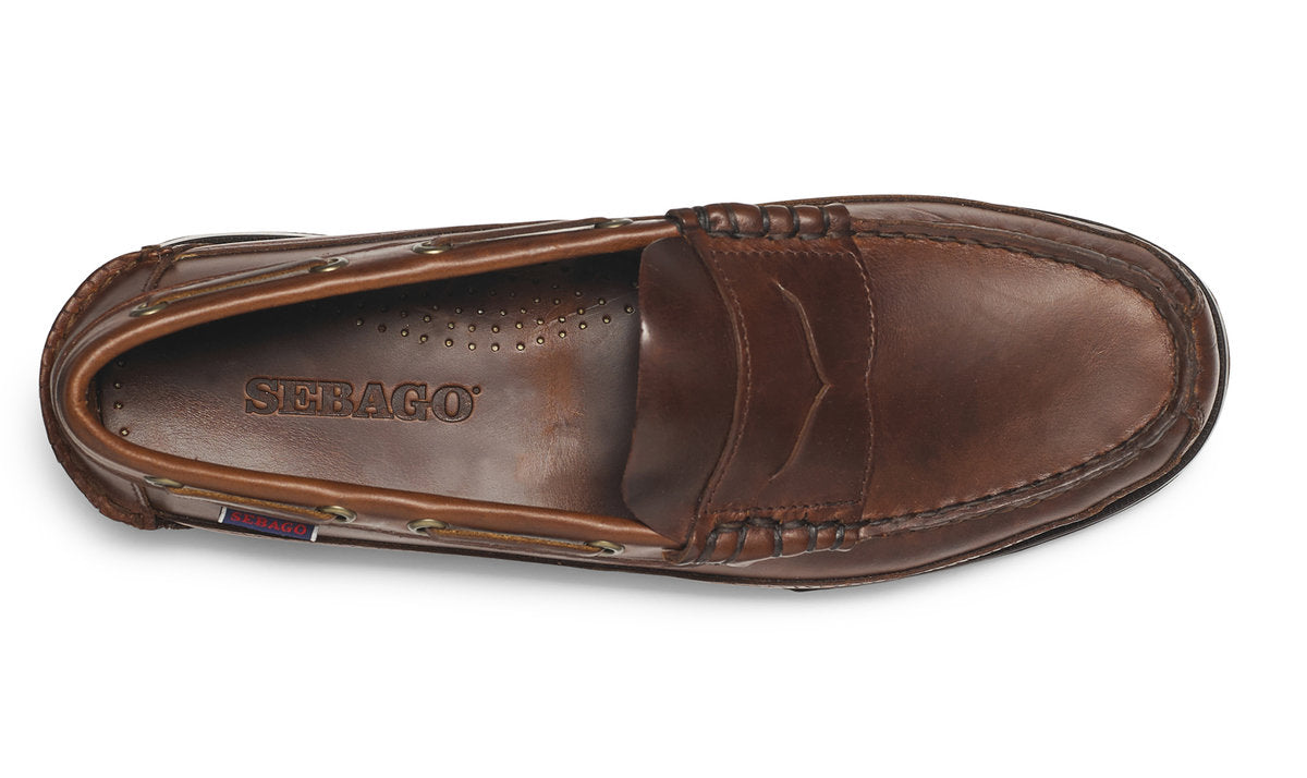 Brown leather loafers from original US boat shoe stylists Sebago, featuring handsewn construction, leather uppers, cushioned sock lining and brown leather construction.