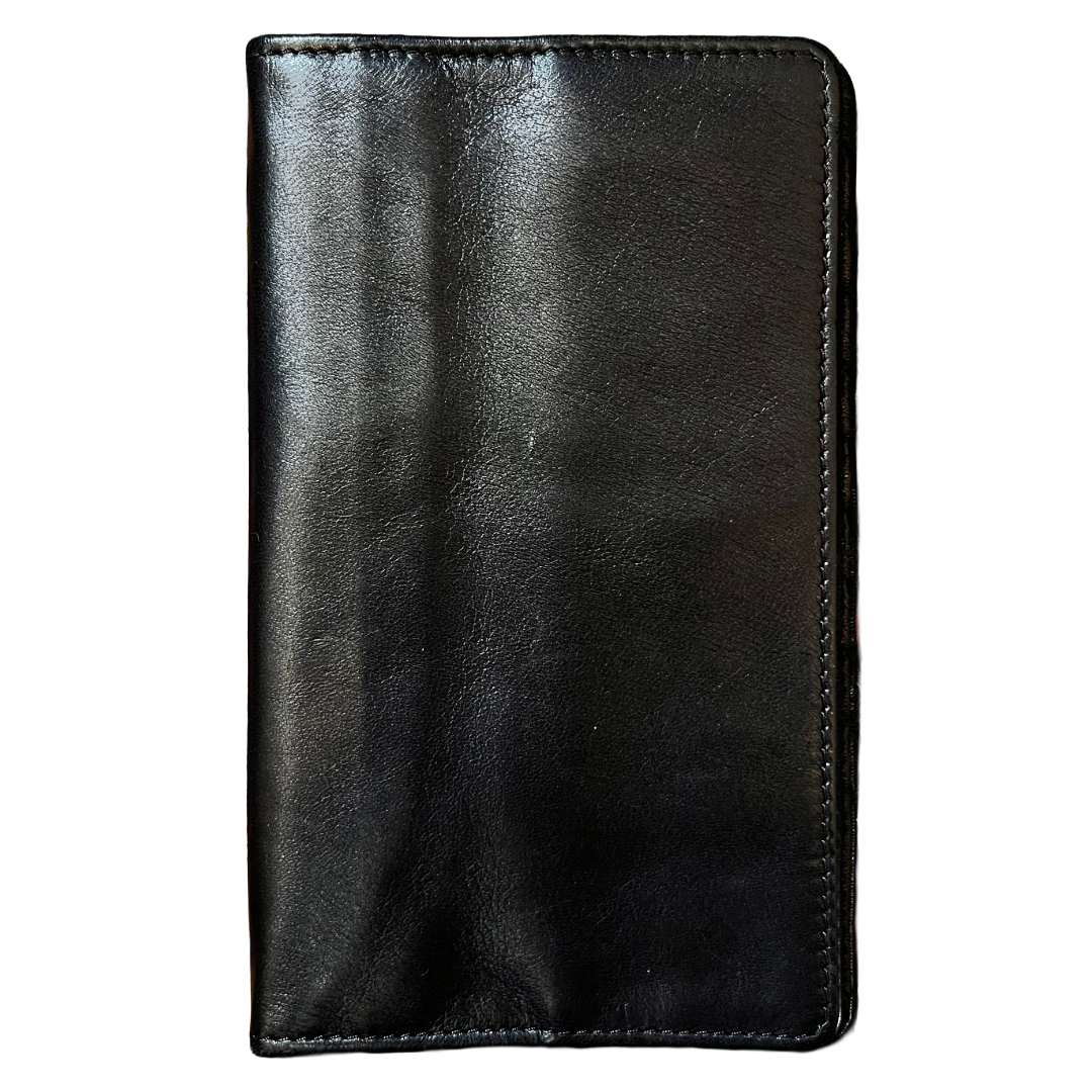 A black leather wallet or card holder with visible stitching along the edges, shown flat against a plain white background.