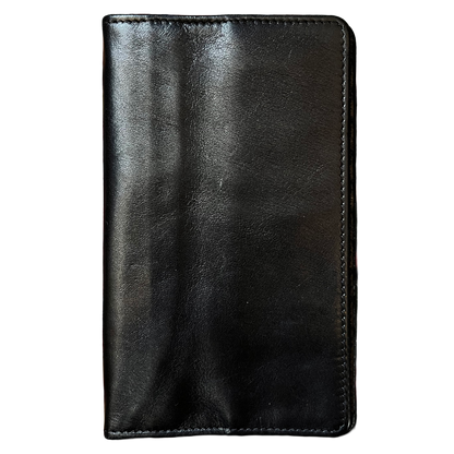 A black leather wallet or card holder with visible stitching along the edges, shown flat against a plain white background.