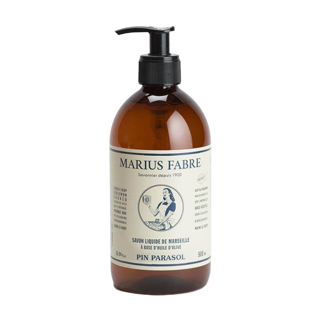 A 500 ml amber glass bottle of Marius Fabré Pin Parasol liquid hair conditioner with a black pump dispenser and a cream-colored label, shown on a plain white background.