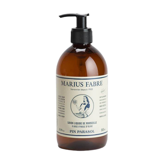 A 500 ml amber glass bottle of Marius Fabré Pin Parasol liquid hair conditioner with a black pump dispenser and a cream-colored label, shown on a plain white background.