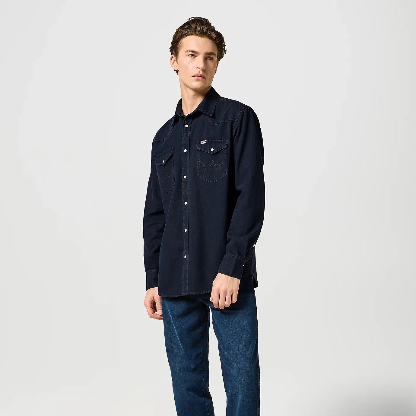 Dark denim shirt with button up shirt and pockets and detailed shoulder plackets.