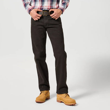 Person wearing a plaid shirt, black pants, and tan shoes on a white background