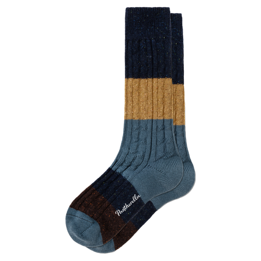 A pair of multi-colored crew socks with horizontal stripes of navy blue, tan, slate blue, and dark brown, featuring a ribbed leg and a white embroidered 'Rathbone' brand name on the toe.