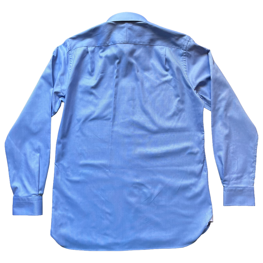 A light blue long-sleeve button-up shirt shown from the back, laid flat 