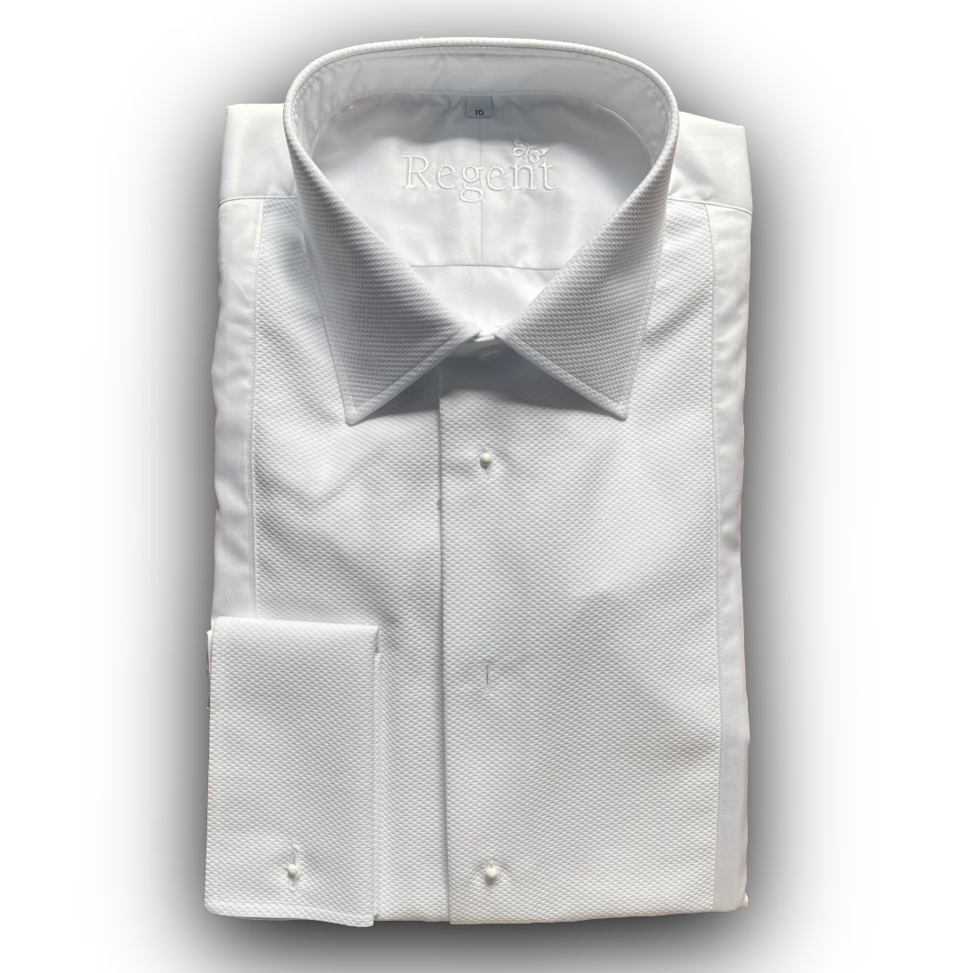 Folded white dress shirt with cufflinks on a light gray background
