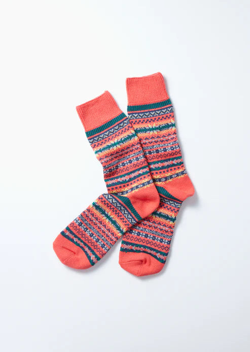 red fair isle knit sock with a geometric pattern in multiple colours 