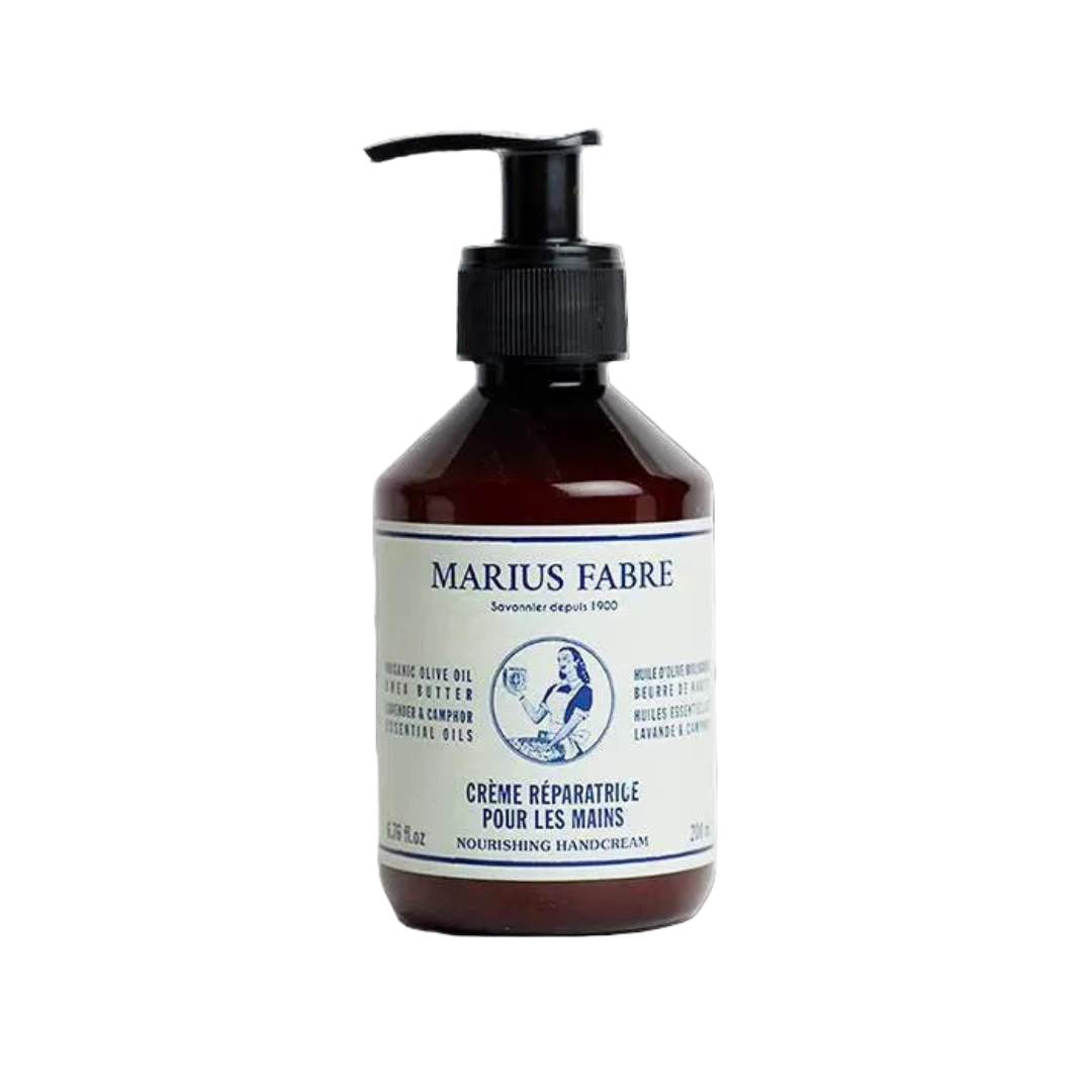 A bottle of Marius Fabre Crème Réparatrice pour les mains, featuring a dark amber brown bottle with a black pump dispenser and a white label with blue text.